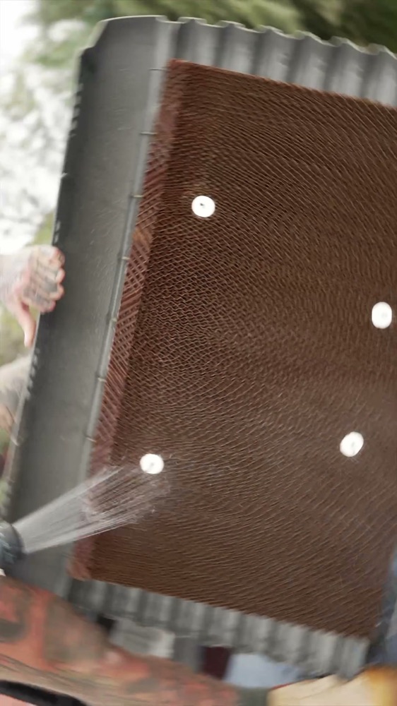 Washing evaporative cooler pads
