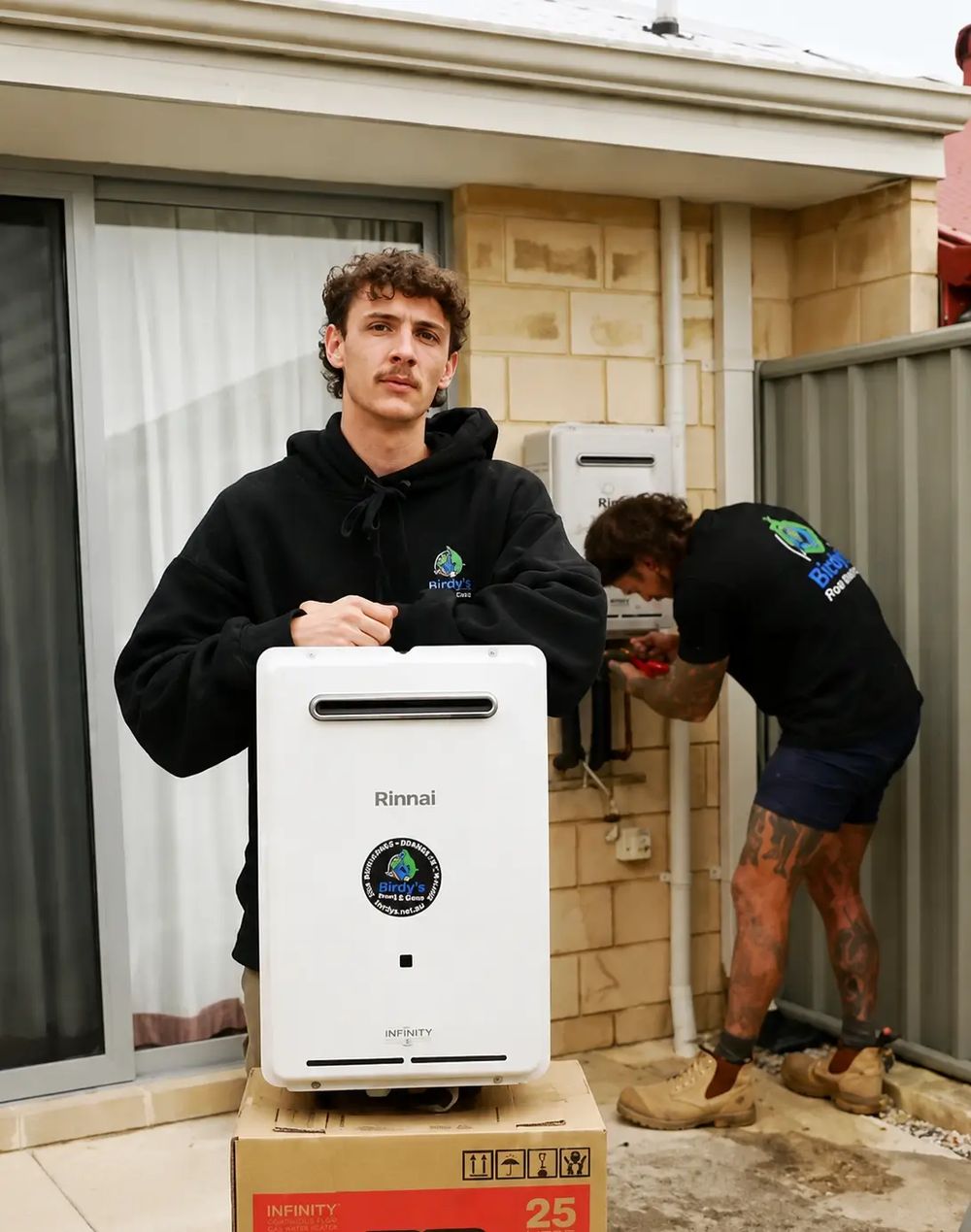 Birdy's plumbers installing a continuous flow hot water unit