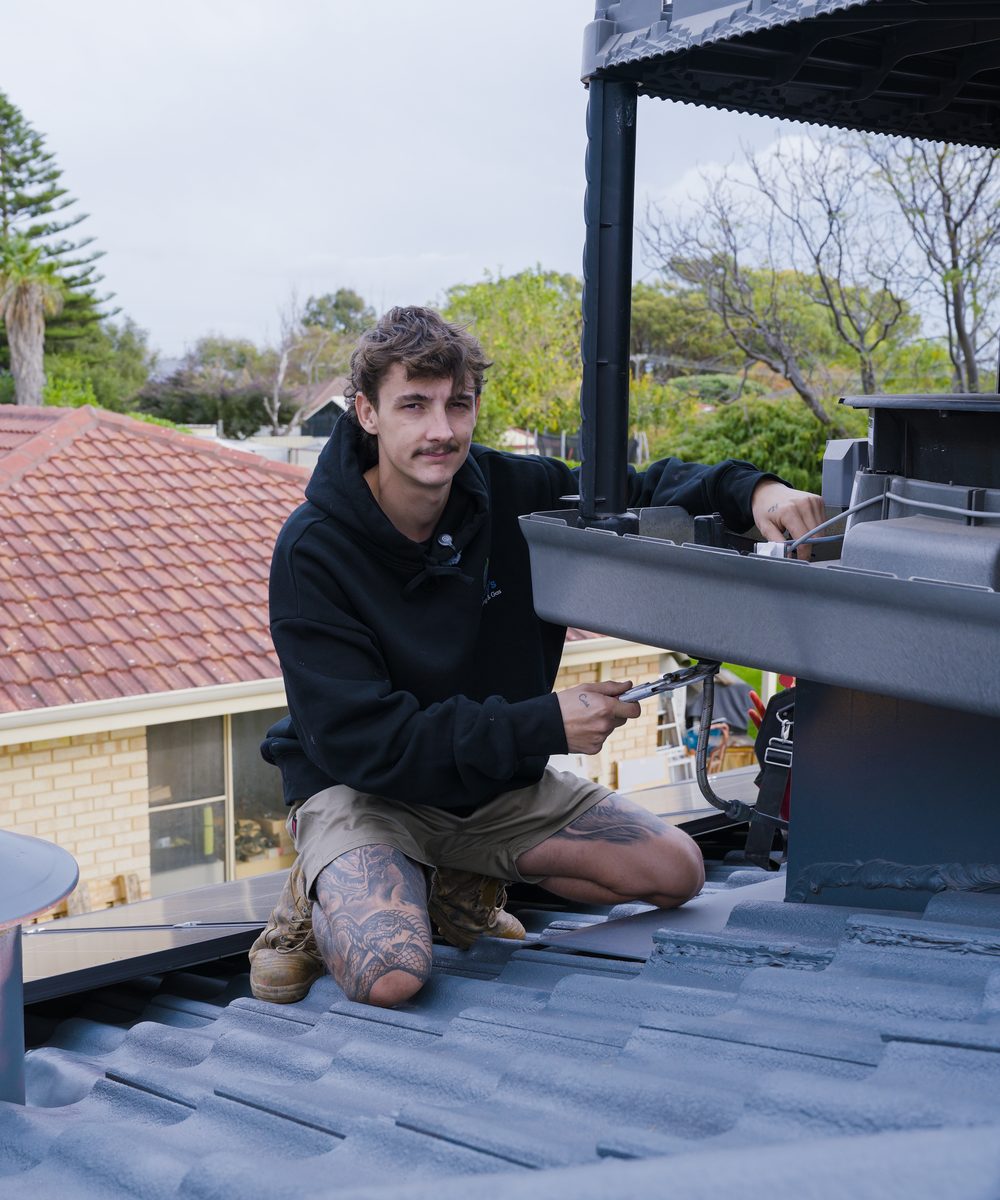 Birdy's technician working on an evaporative unit on the roof