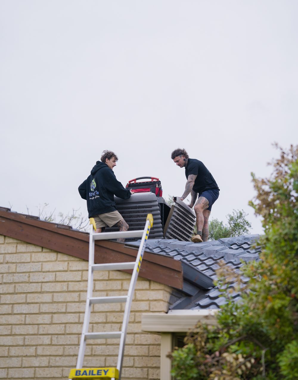 Birdy's crew on the roof at an evaporative cooler